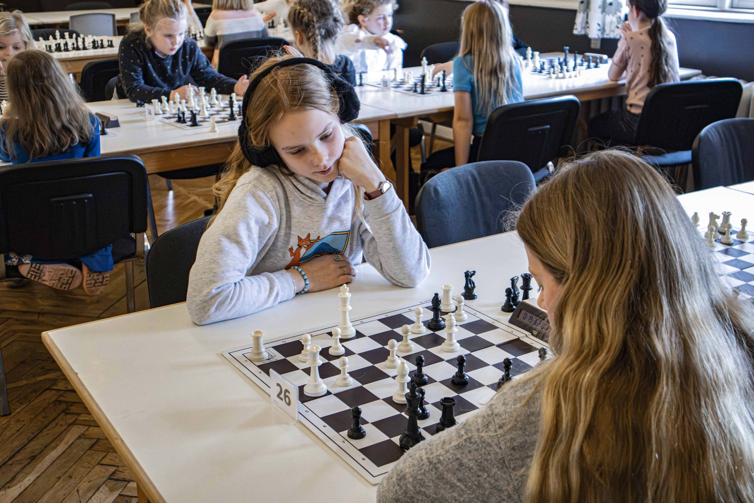 Classroom Chess Learning Activity Students concentrate on a chess game during a classroom learning activity.